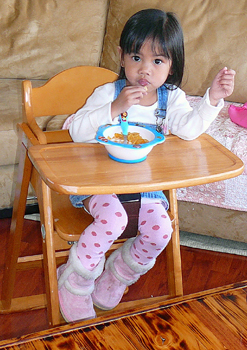 Kathy in her highchair